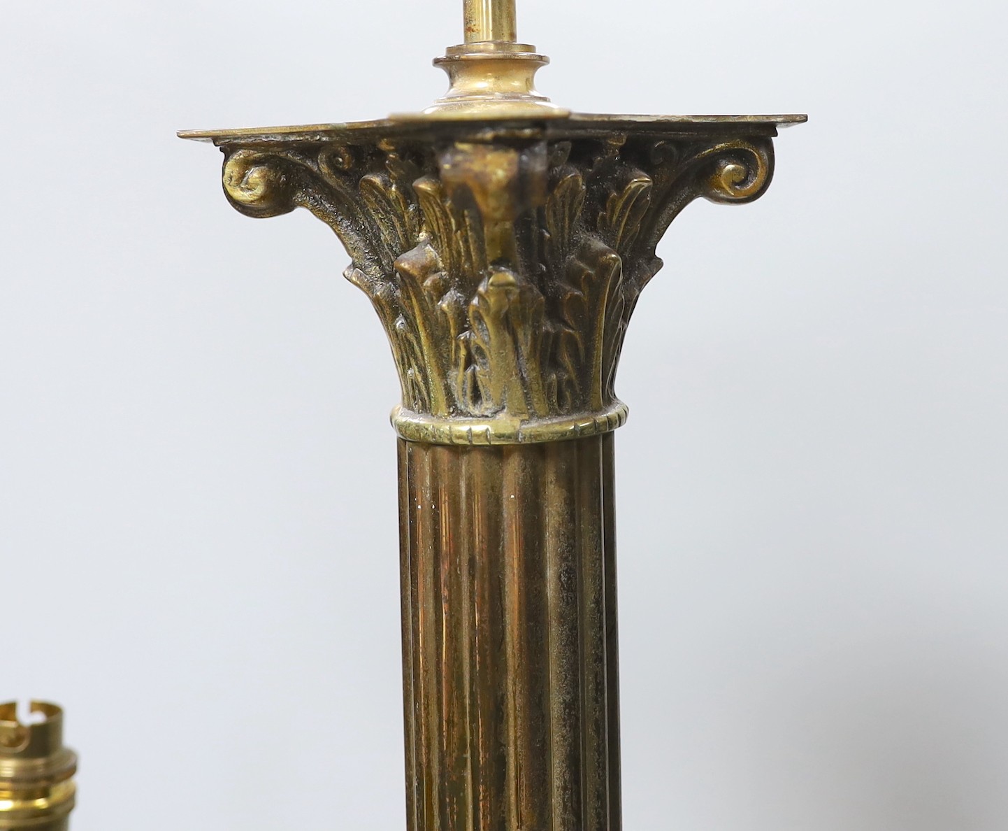 A Corinthian column lamp base and a two handled brass lamp base, tallest 60cms excluding light fitting